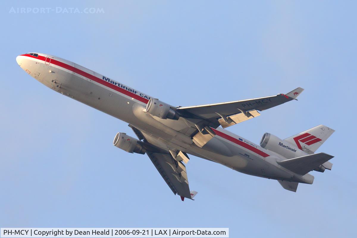 PH-MCY, 1991 McDonnell Douglas MD-11F C/N 48445, Martinair Cargo PH-MCY (FLT MPH70) on a steep climb from RWY 25R enroute to Seattle Tacoma Int'l (KSEA) late in the day.