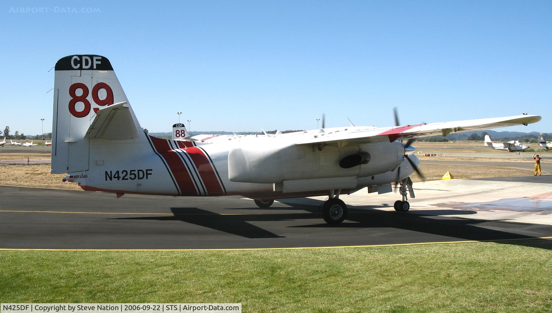 N425DF, 1999 Marsh Aviation S-2F3AT C/N 152825, Grass Valley-based CDF S-2T Tanker #89 with Joe Satrapa at the controls taxying back to tanker base at Sonoma County Airport, CA to reload