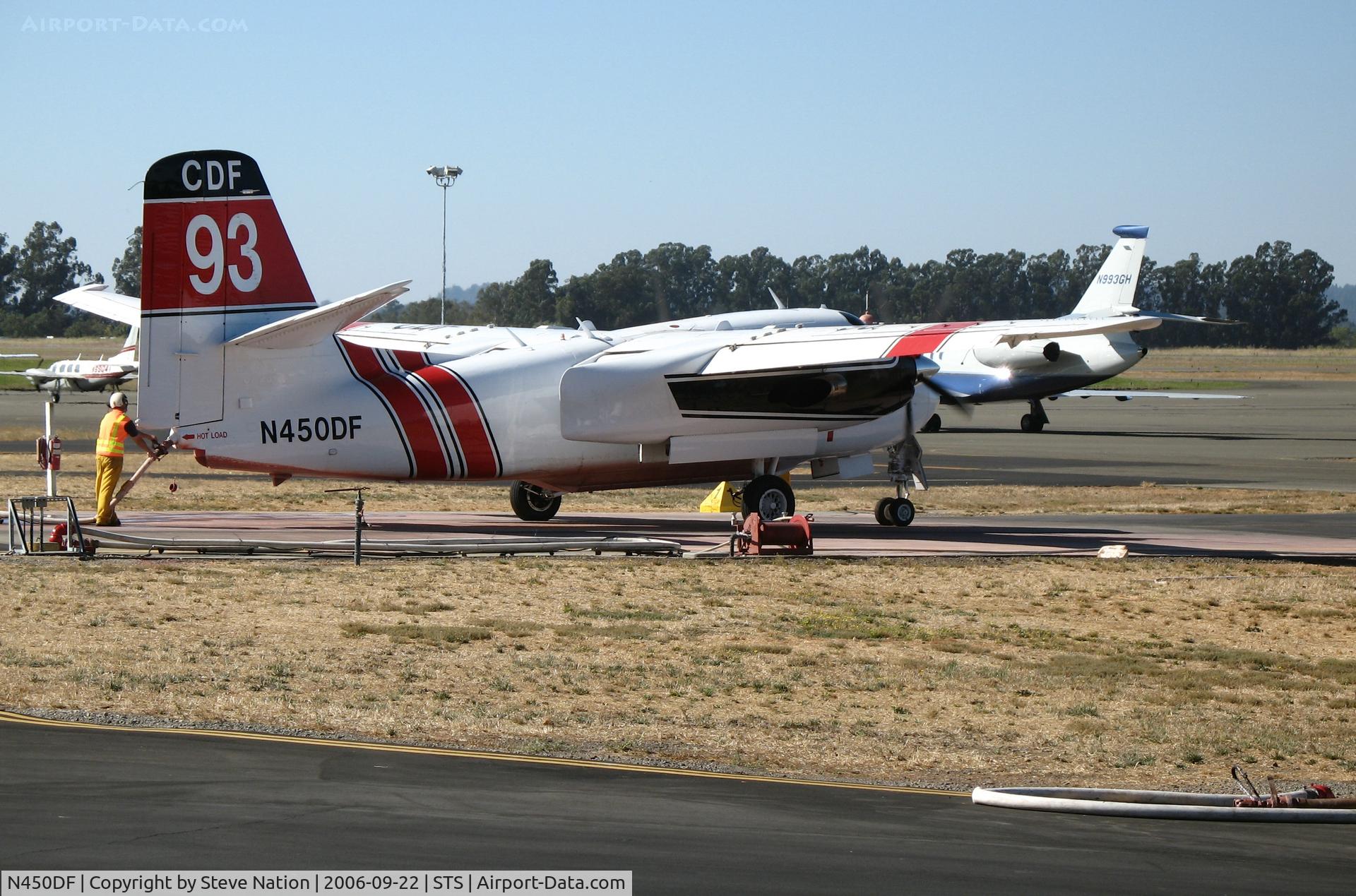 N450DF, 2005 Marsh Aviation S-2F3AT C/N 152341, Chico-based CDF S-2T Tanker #93 with Walt Darran at the controls takes on retardent at Sonoma County Airport, CA with full load