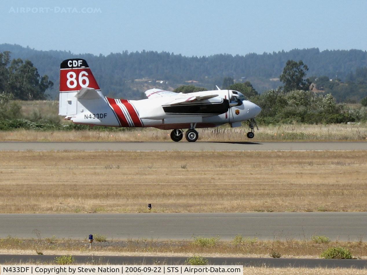 N433DF, Marsh Aviation S-2F3AT C/N 149855, Santa Rosa-based CDF S-2T Tanker #86 with Bob Valette at the controls touches down in nasty crosswind at Sonoma County Airport, CA following firefighting mission