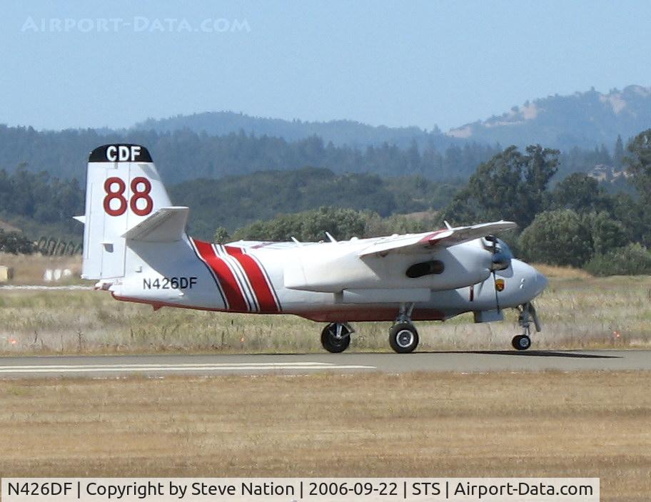 N426DF, 1999 Marsh Aviation S-2F3AT C/N 152824, Grass Valley-based CDF S-2T Tanker #88 with Bob Finer at the controls touching down in nasty crosswind at Sonoma County Airport, CA following firefighting mission