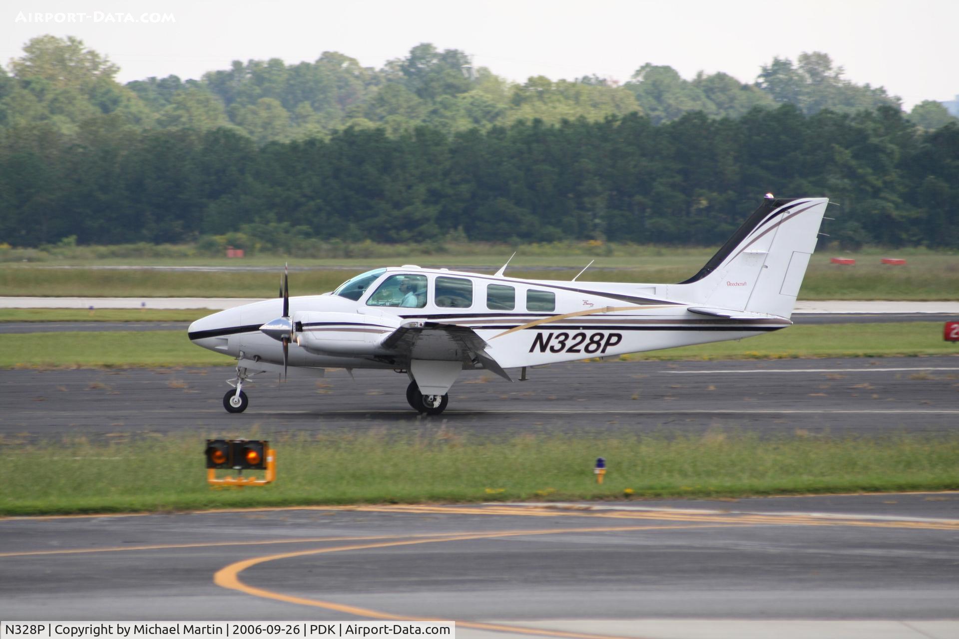 N328P, 1999 Raytheon Aircraft Company 58 C/N TH-1916, Departing PDK enroute home