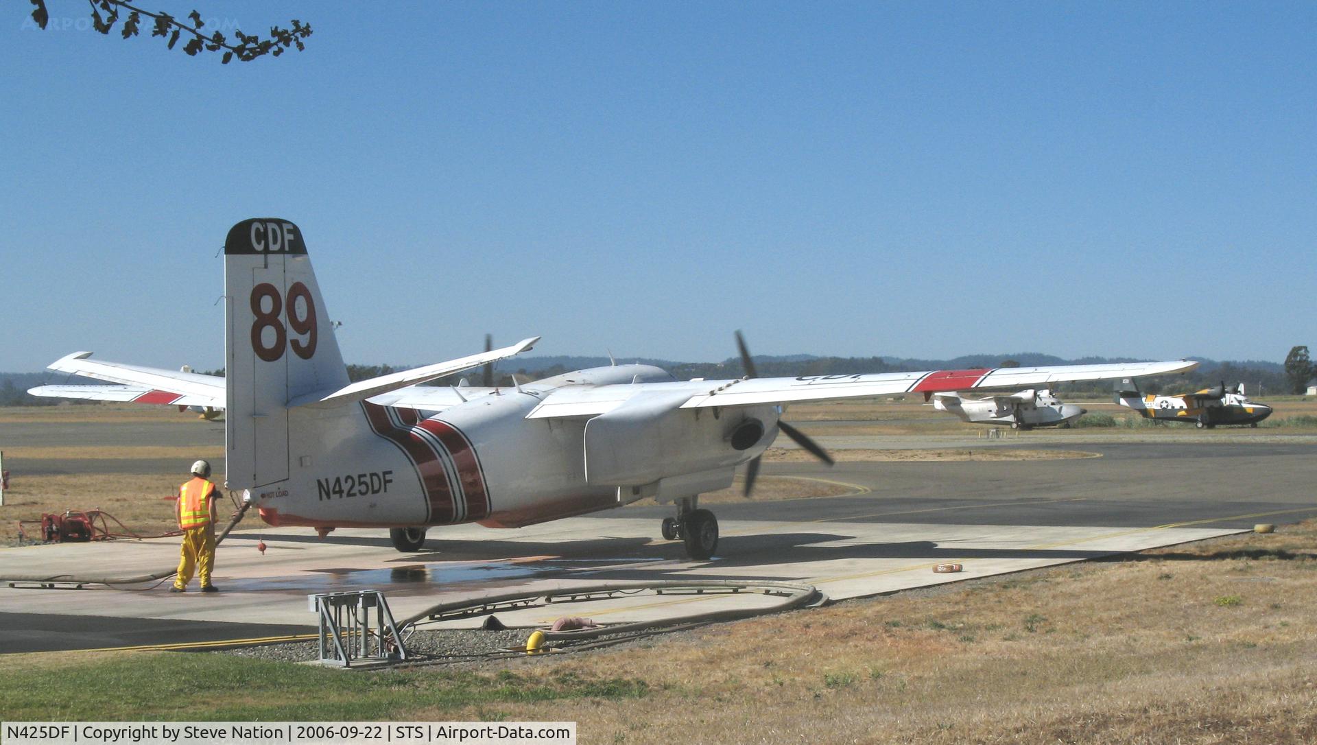 N425DF, 1999 Marsh Aviation S-2F3AT C/N 152825, Grass Valley-based CDF S-2T Tanker #89 with Joe Satrapa at the controls idling on ramp while being loaded with retardent at tanker base at Sonoma County Airport, CA