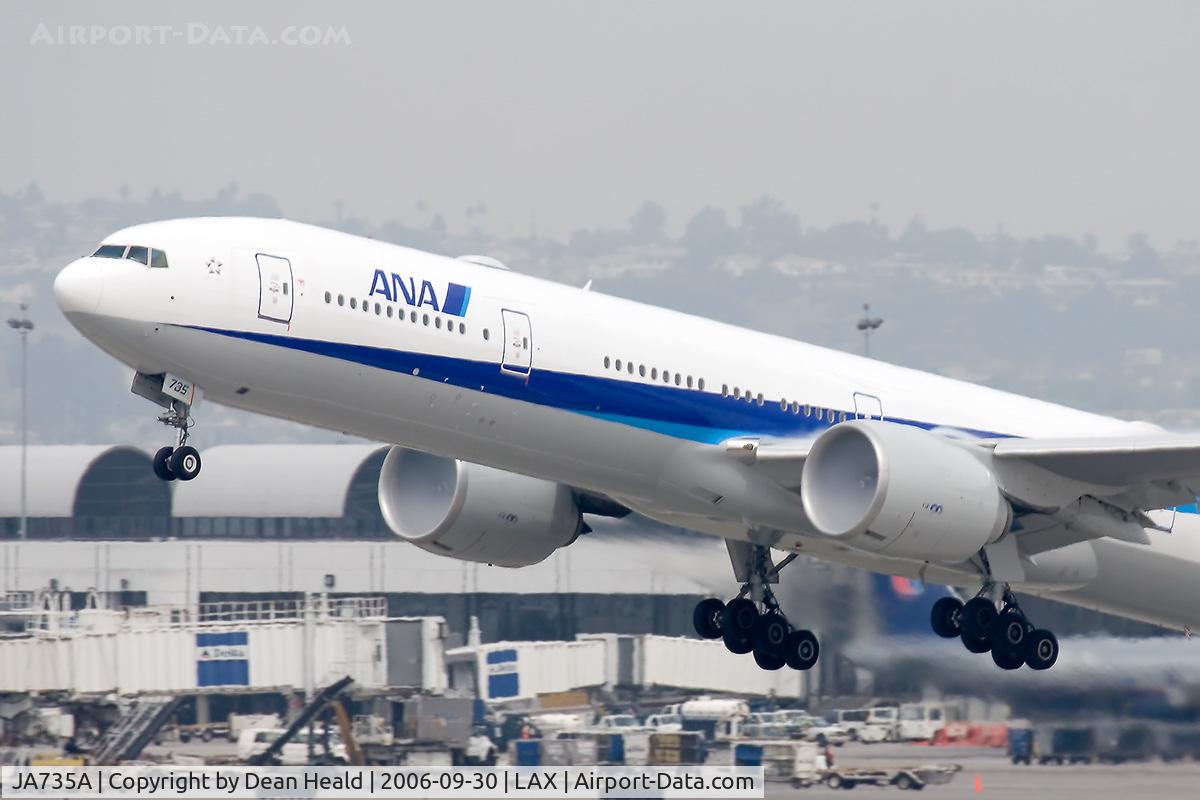 JA735A, 2006 Boeing 777-381/ER C/N 34892/571, All Nippon Airways JA735A (FLT ANA5) - with condensation forming at the engine faces - departing RWY 25R enroute to Narita Int'l (RJAA).