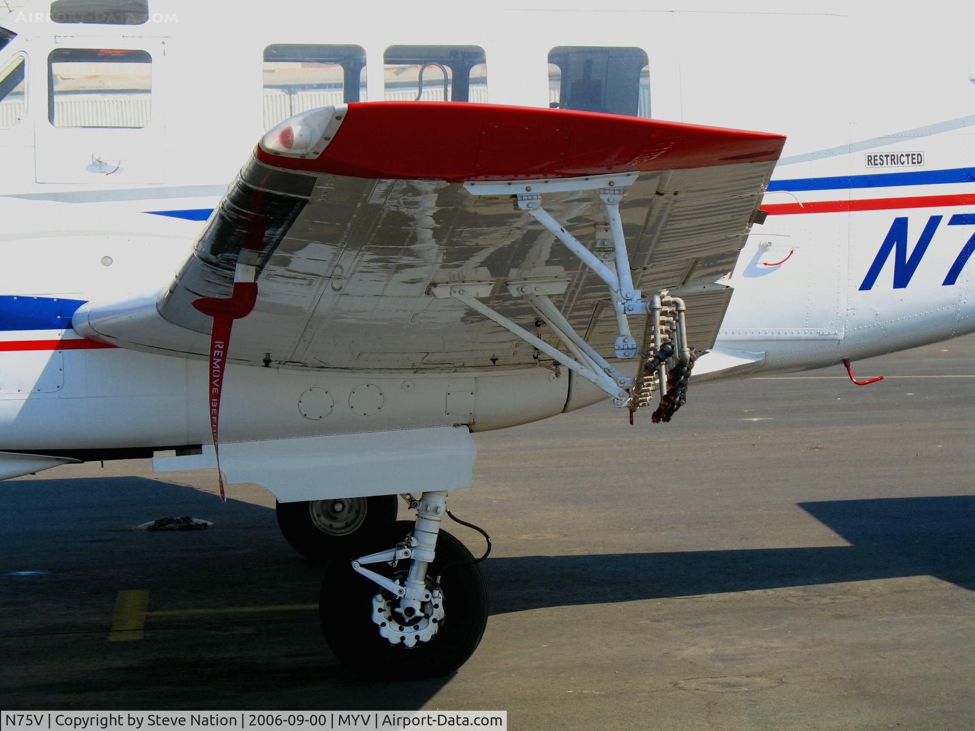 N75V, 1968 Beech 65-A90-1 C/N LM-103, close-up of spray bar on 1968 Beech 65-90A-1 @ Yuba County Airport (Marysville), CA