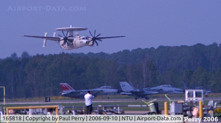 165818, 2000 Northrop Grumman E-2C Hawkeye C/N A189, Ingressing low, over more Navy Assets