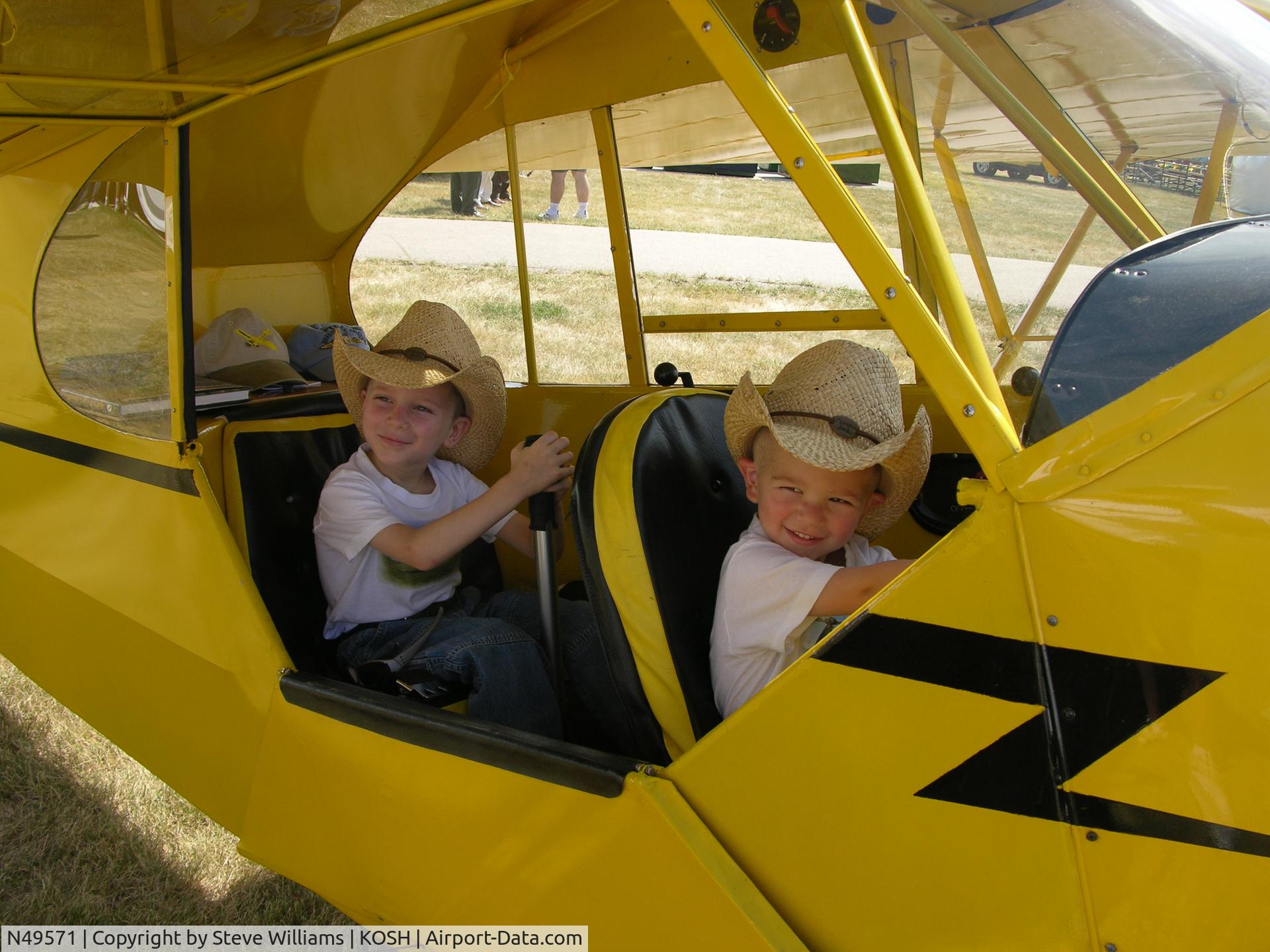N49571, 1942 Piper J3C-65 Cub C/N 9927, Garrett and Trent Williams in the Cub at Oshkosh