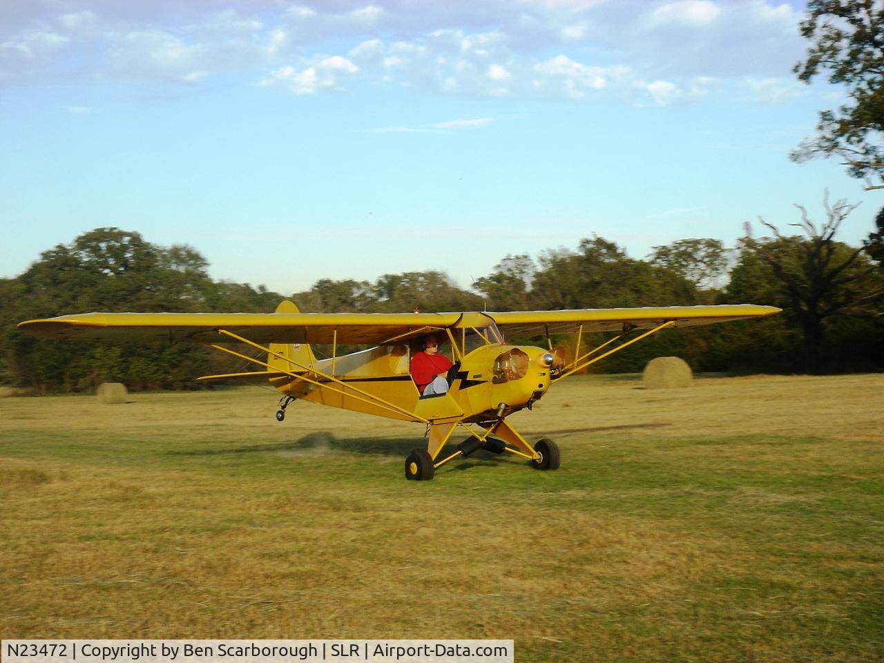 N23472, 1939 Piper J3C-65 Cub C/N 3188, Roger Elliott at Marlin's Meadow Airport in Yantis, TX.