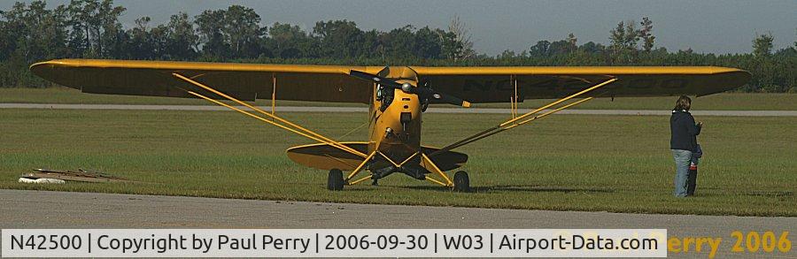 N42500, 1945 Piper J3C-65 Cub C/N 14772, Taking up not too much grass on the taxiway