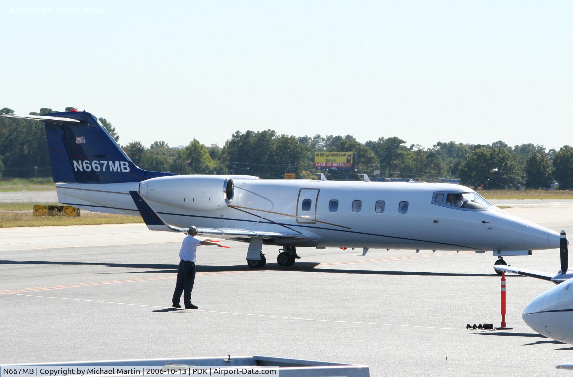 N667MB, 1982 Learjet 55 C/N 073, Being marshalled at Mercury Air Center