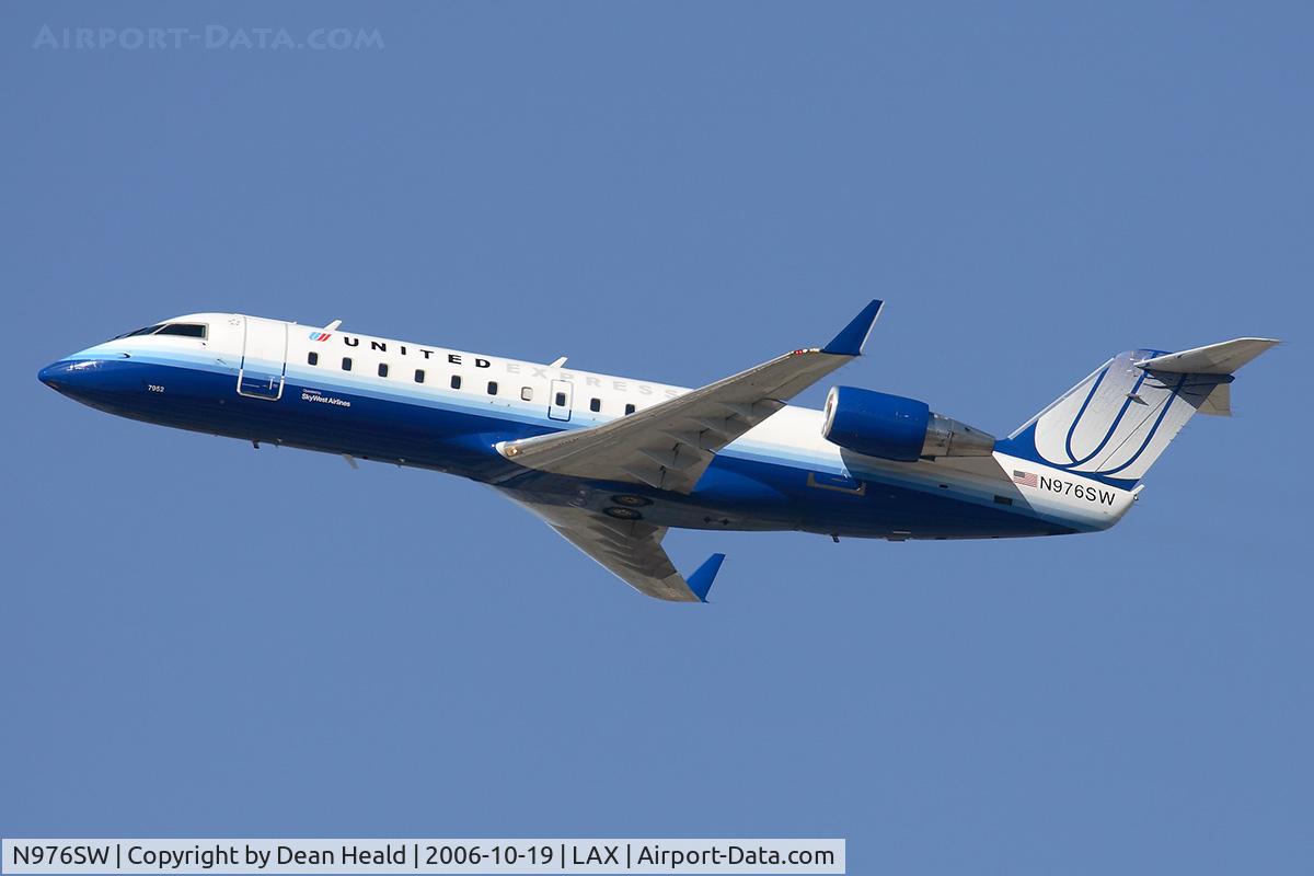 N976SW, 2004 Bombardier CRJ-100ER (CL-600-2B19) C/N 7952, United Express (operated by SkyWest Airlines) N976SW (FLT SKW6498) climbing out from RWY 25R enroute to Tucson Int'l (KTUS).