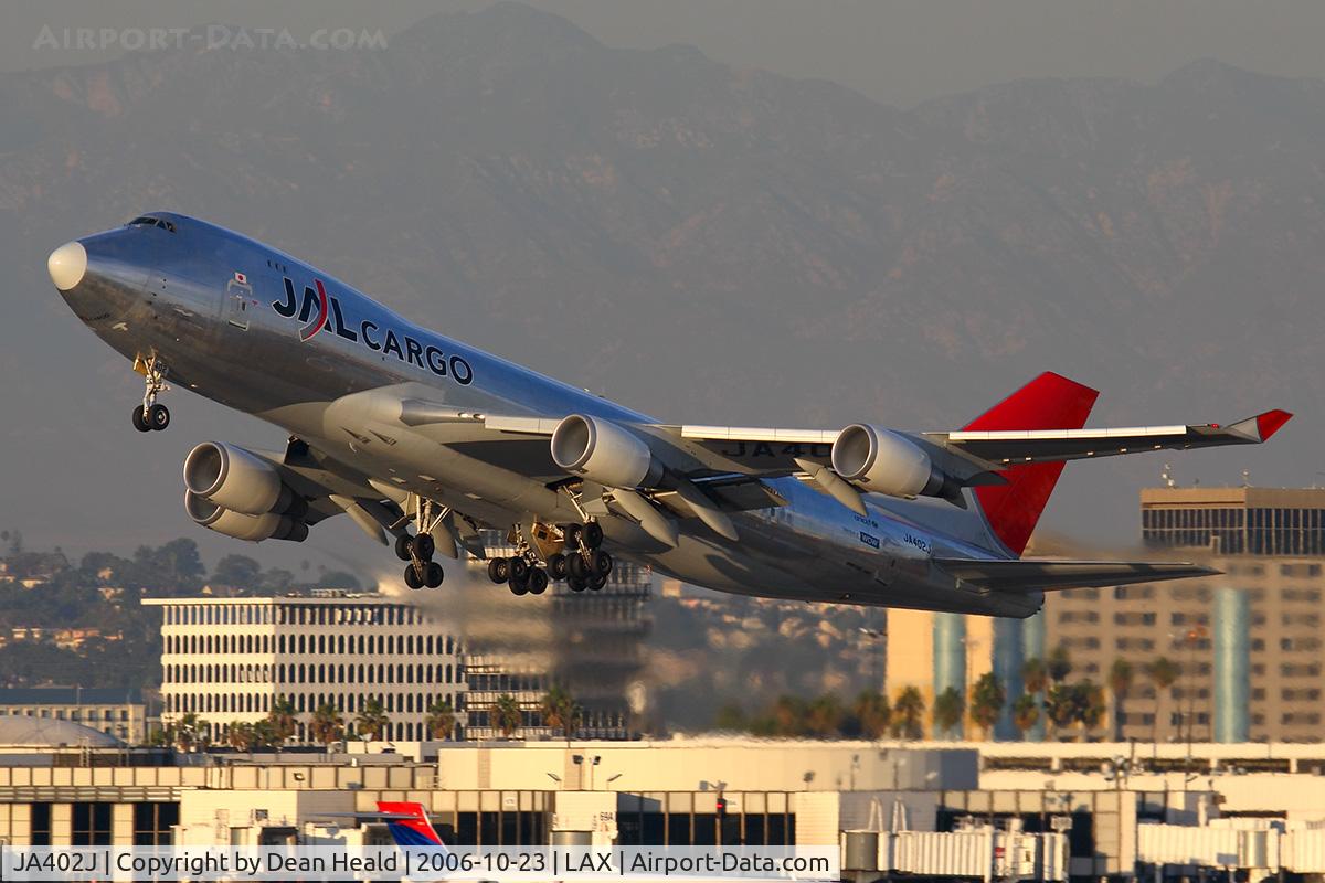JA402J, 2004 Boeing 747-446F C/N 33749, JAL Cargo JA402J (FLT JAL6063) climbing out from RWY 25R enroute to Narita Int'l (RJAA). Note the condensation at each engine face.