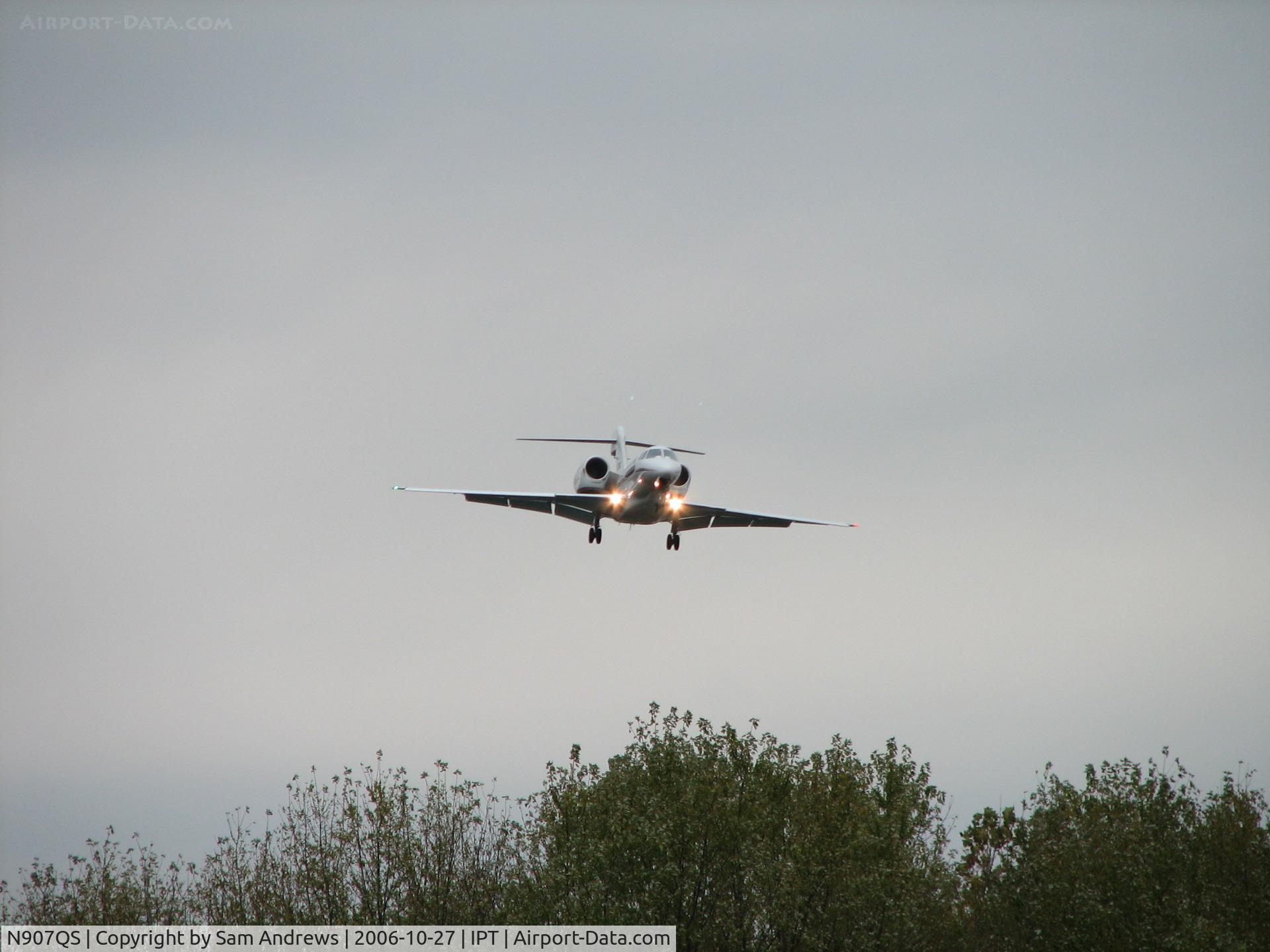 N907QS, 2002 Cessna 750 Citation X C/N 750-0201, Circled to land after the low ceiling kept them from finding the airport so a low approach.  This was shot just over the trees.