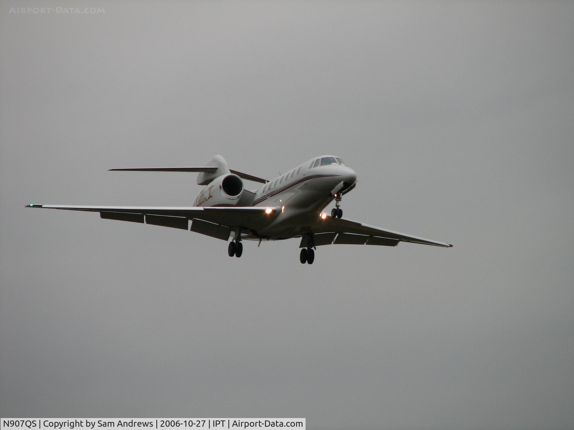 N907QS, 2002 Cessna 750 Citation X C/N 750-0201, You can see the 3500 foot overcast sky in this one.   He is just before the fence.