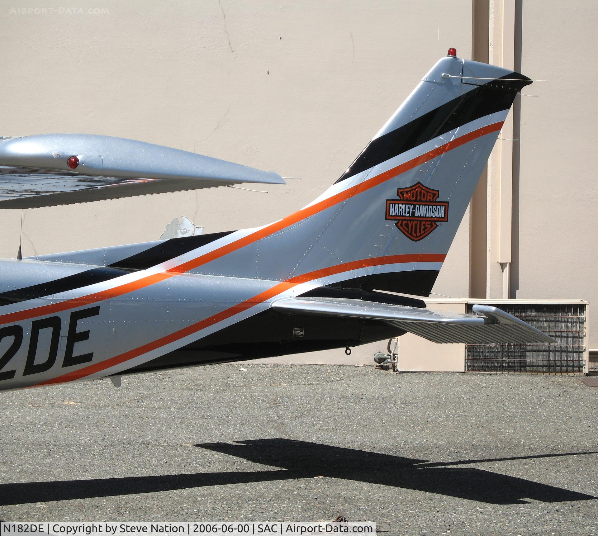 N182DE, 1985 Cessna 182R Skylane C/N 18268540, Harley-Davidson Motorcycles tail logo on Sacramento Aviation Management 1985 Cessna 182R @ Sacramento Executive Airport, CA