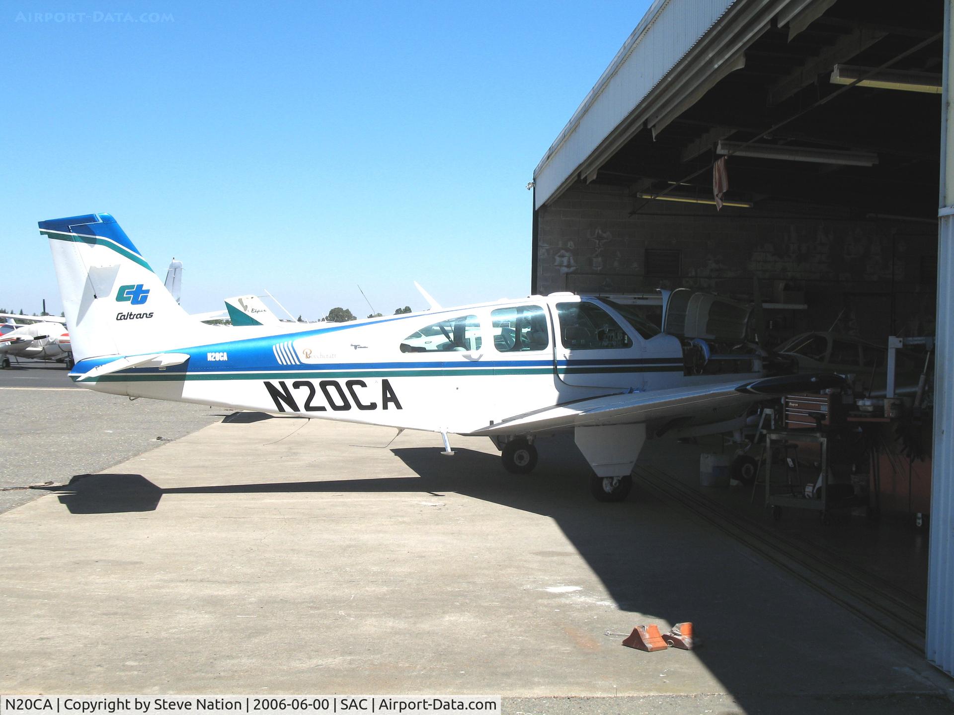 N20CA, 1969 Beech E33A Bonanza C/N CE-285, CALTRANS 1969 Beech E33A with her nose in the hangar @ Sacramento Executive Airport, CA