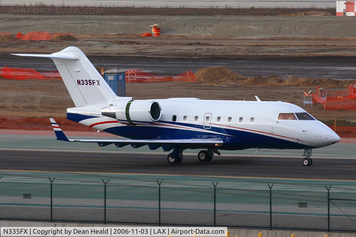 N335FX, 2005 Bombardier Challenger 604 (CL-600-2B16) C/N 5619, N335FX taxiing to transient parking after arrival on the north complex from San Francisco Int'l (KSFO).