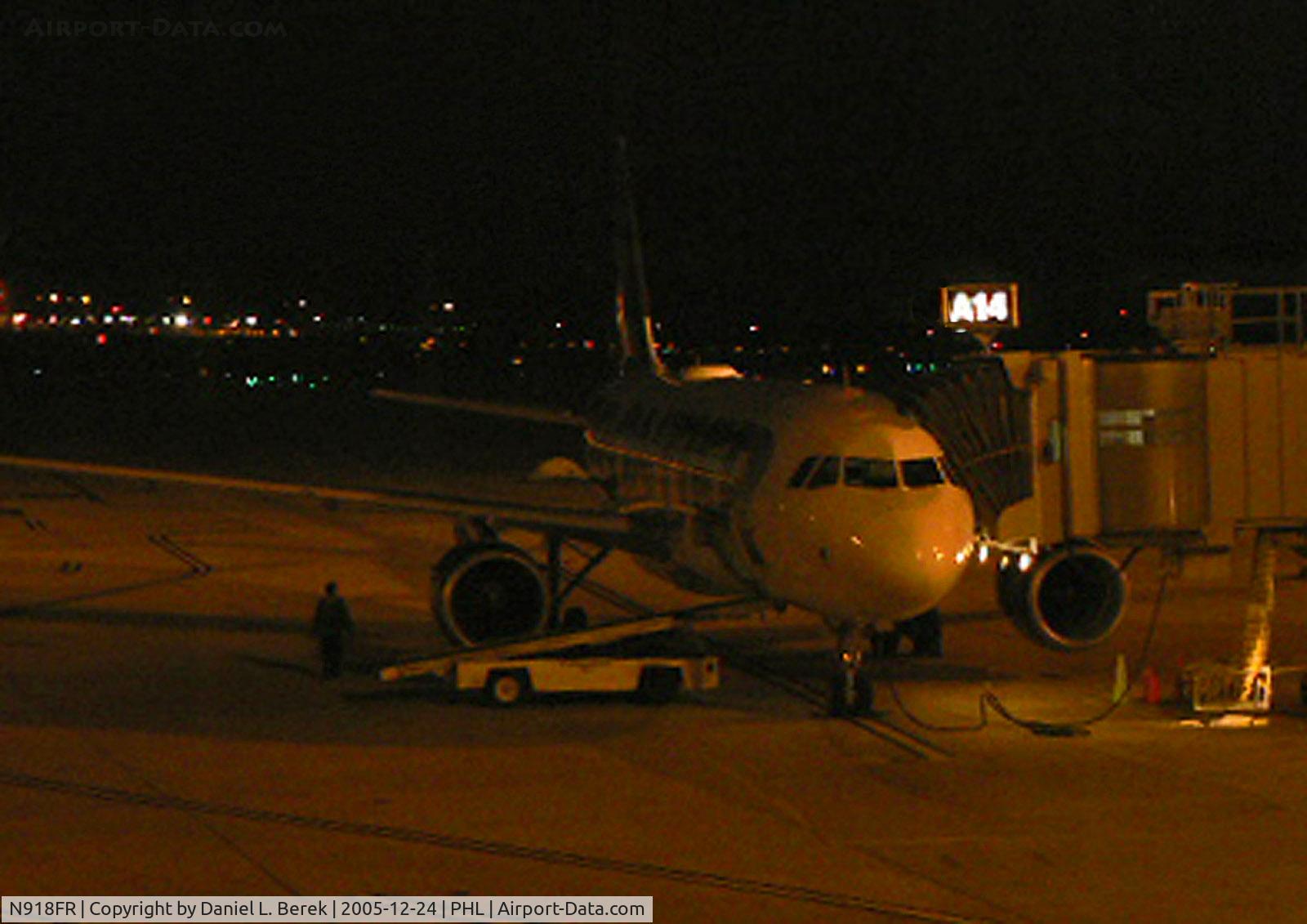 N918FR, 2003 Airbus A319-111 C/N 1943, A Frontier A319 waits in the predawn darkness for its return trip to Denver. This aircraft features the whitetail deer on its tail. Beautiful aircraft!
