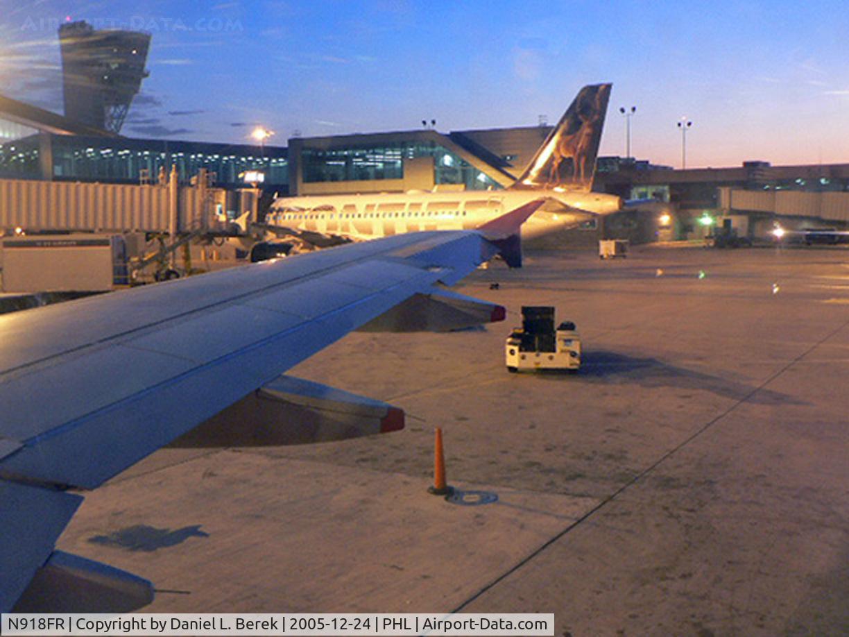 N918FR, 2003 Airbus A319-111 C/N 1943, Another view of this aircraft, showing the whitetail deer motif. Taken from an Air Jamaica A320 in the early morning.