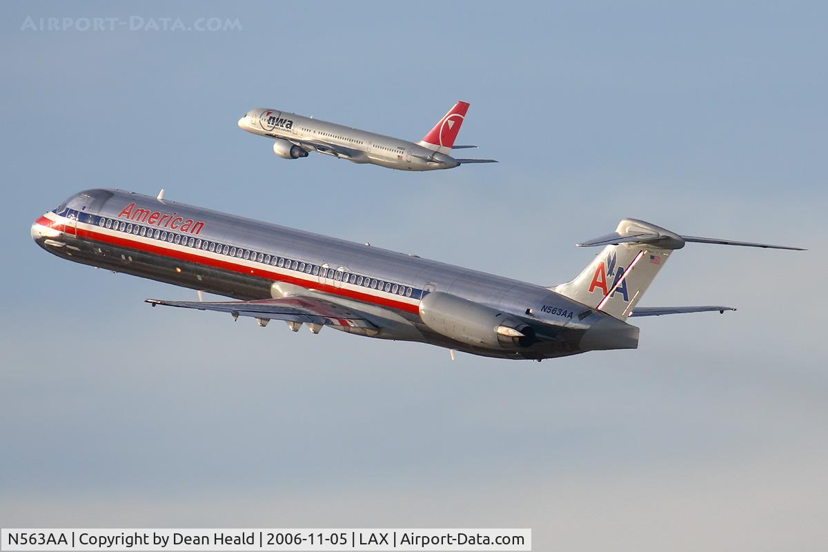 N563AA, 1987 McDonnell Douglas MD-83 (DC-9-83) C/N 49345, American Airlines N563AA (FLT AAL768) climbing out from RWY 25R enroute to Lambert St Louis Int'l (KSTL). In the background, Northwest Flight 308 is climbing out from RWY 24L enroute to Minneapolis St Paul Int'l (KMSP).