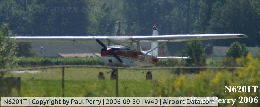 N6201T, 1964 Cessna 150E C/N 15060901, One of the two planes parked on this sunny day in Mount Olive