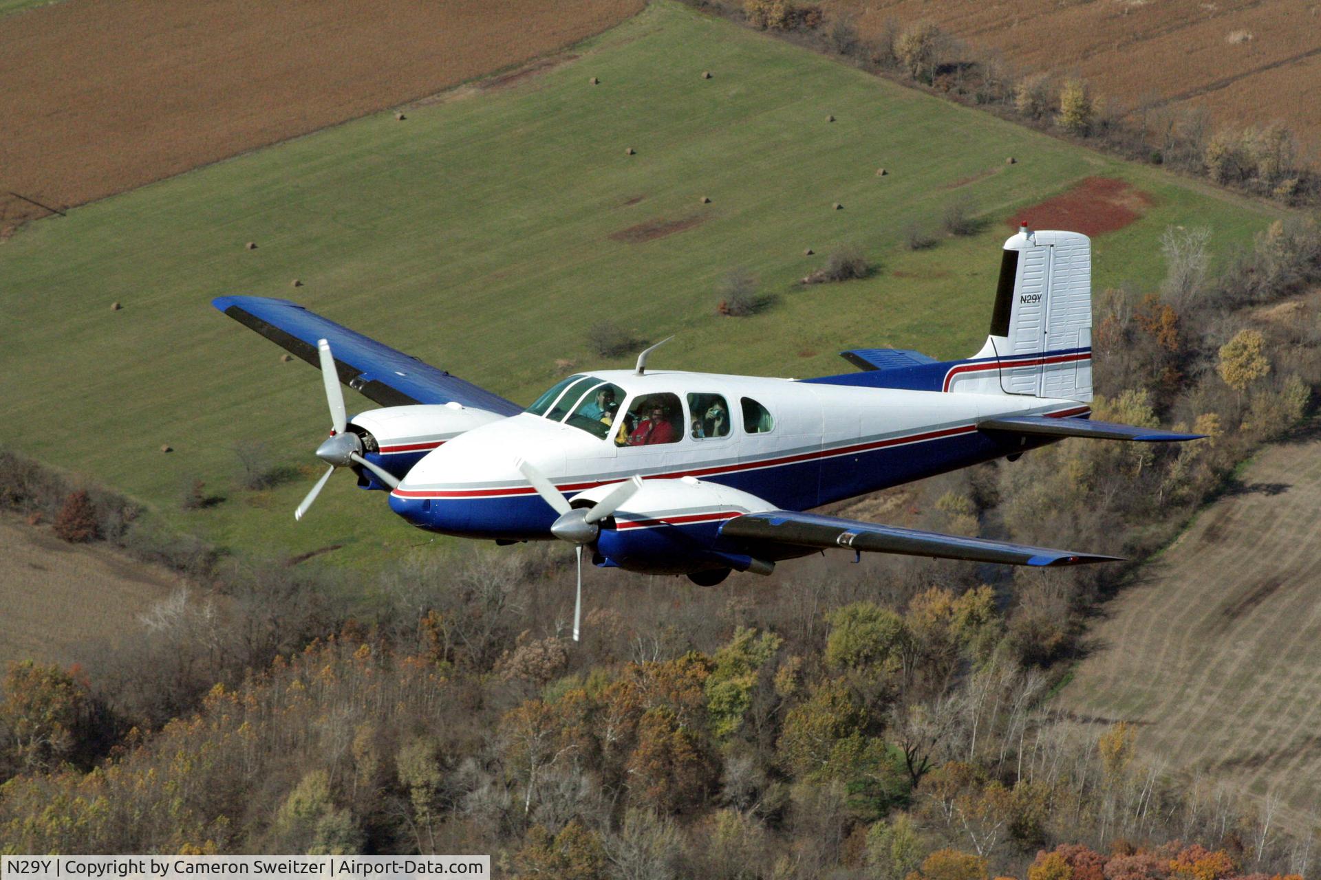N29Y, 1957 Beech E50 Twin Bonanza C/N EH-16, Les Gorden's Twin Bonanza flying circles around my 150
