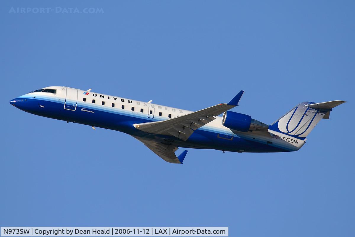 N973SW, 2004 Bombardier CRJ-200ER (CL-600-2B19) C/N 7949, Sky West Airlines (United Express) N973SW (FLT SKW6498) climbing out from RWY 25R enroute to Tucson Int'l (KTUS).