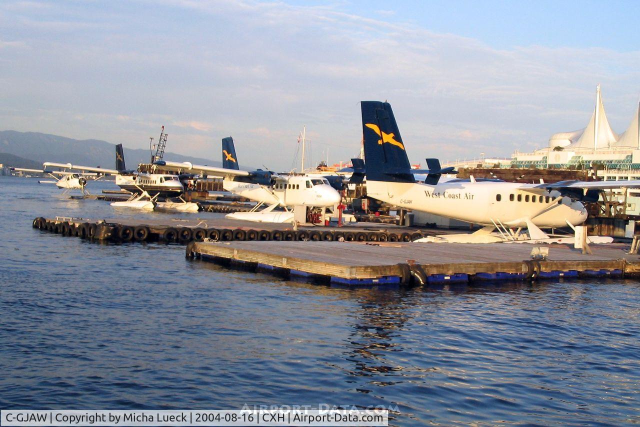 C-GJAW, 1968 De Havilland Canada DHC-6-200 Twin Otter C/N 176, Basking in the evening sun after a busy summer day. From right to left: C-GJAW, C-FGQH, C-FMHR, and a Beaver