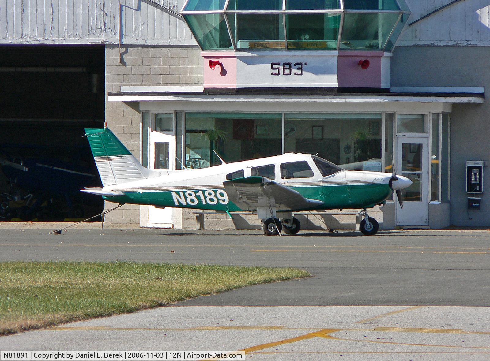 N81891, 1980 Piper PA-28-181 C/N 28-8090285, Green 1980 Archer sits in front of the front office of her home airport.