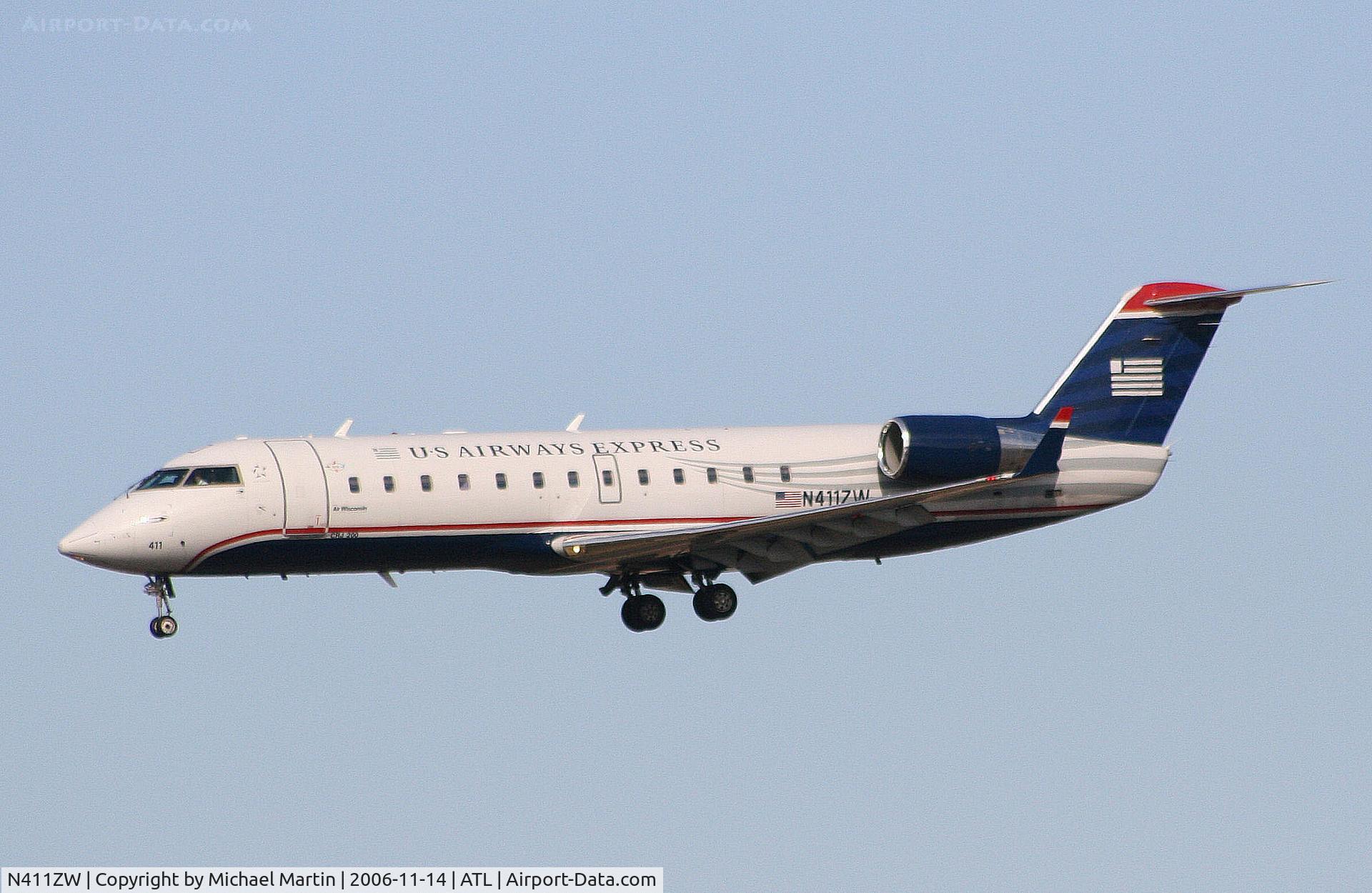 N411ZW, 2001 Bombardier CRJ-200LR (CL-600-2B19) C/N 7569, On final for Runway 27L