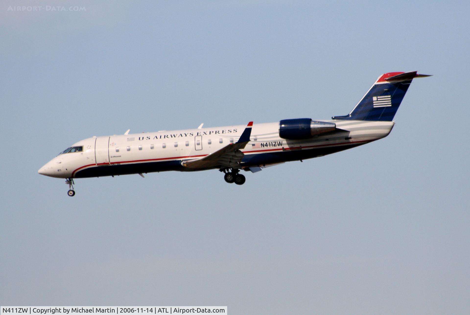 N411ZW, 2001 Bombardier CRJ-200LR (CL-600-2B19) C/N 7569, Over the numbers of 27L
