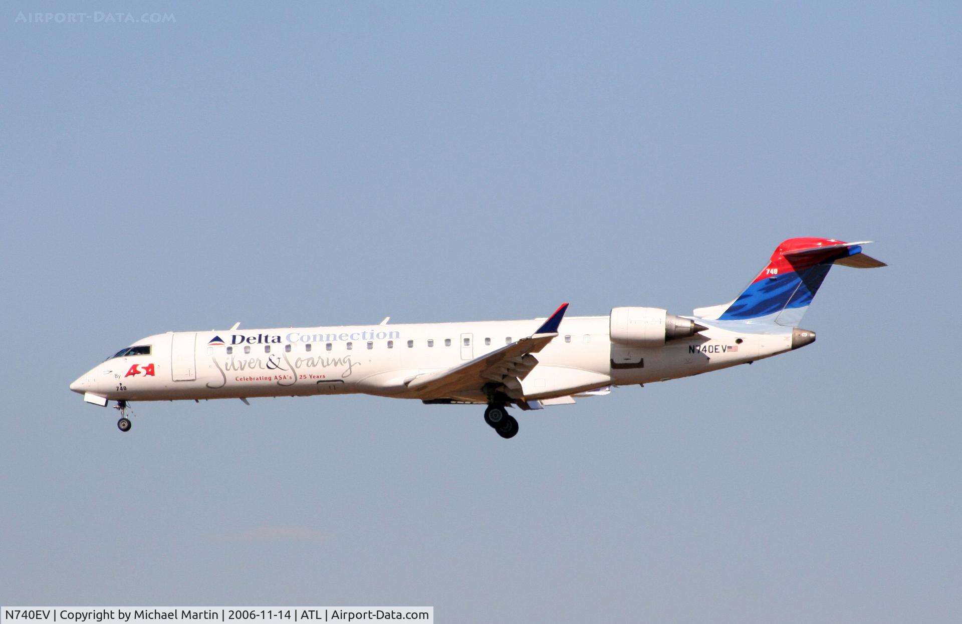 N740EV, 2004 Bombardier CRJ-701 (CL-600-2C10) Regional Jet C/N 10151, Over the numbers of 27L