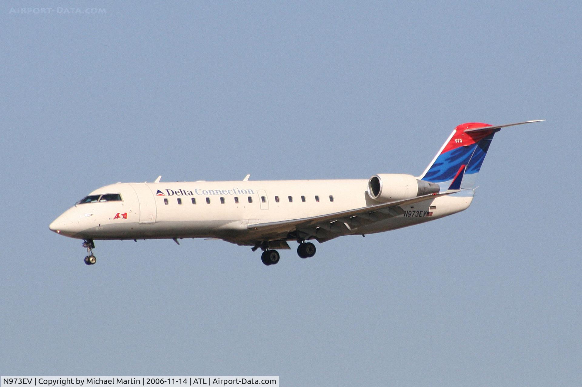N973EV, 2002 Bombardier CRJ-200ER (CL-600-2B19) C/N 7575, On final for Runway 27L