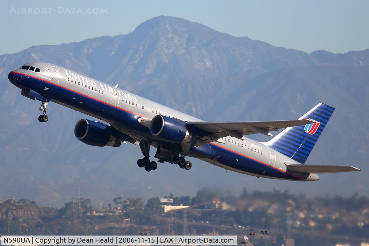 N590UA, 1997 Boeing 757-222 C/N 28708, United Airlines N590UA (FLT UAL106) climbing out from RWY 25R enroute to Chicago Ohare Int'l(KORD) with Strawberry Peak in the background.