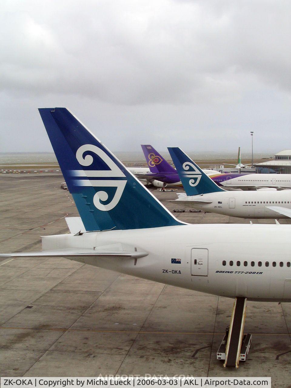 ZK-OKA, 2005 Boeing 777-219/ER C/N 29404, Tails of B 777-200 (ZK-OKA), B 767-300 (ZK-NCL), and A 340-600 (HS-TNA)