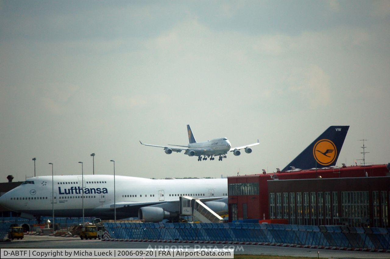 D-ABTF, 1991 Boeing 747-430M C/N 24967, D-ABTF is on short finals, while D-ABVW is being towed to the gate