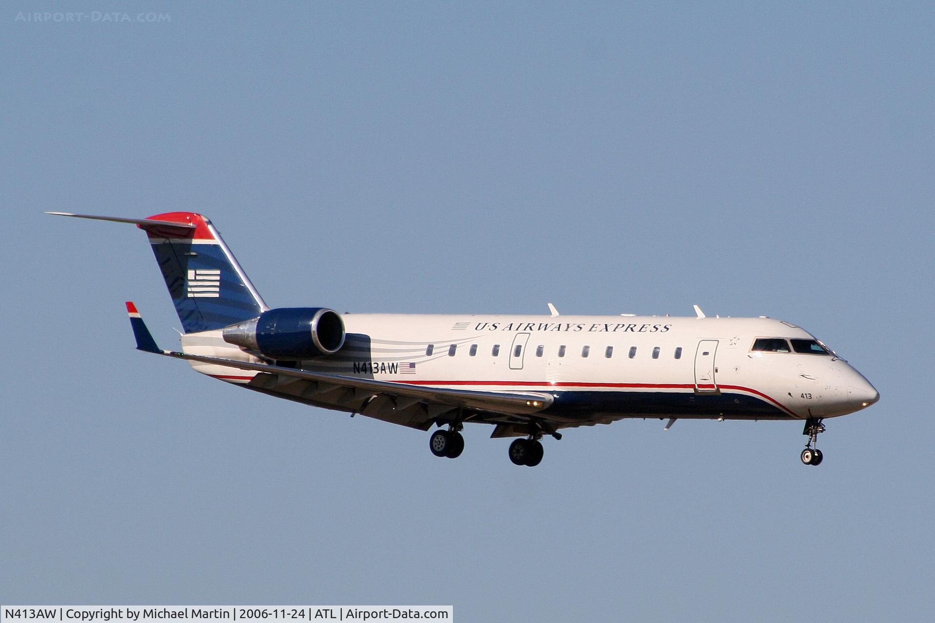 N413AW, 2001 Canadair CRJ-200LR (CL-600-2B19) C/N 7585, On final for Runway 9R
