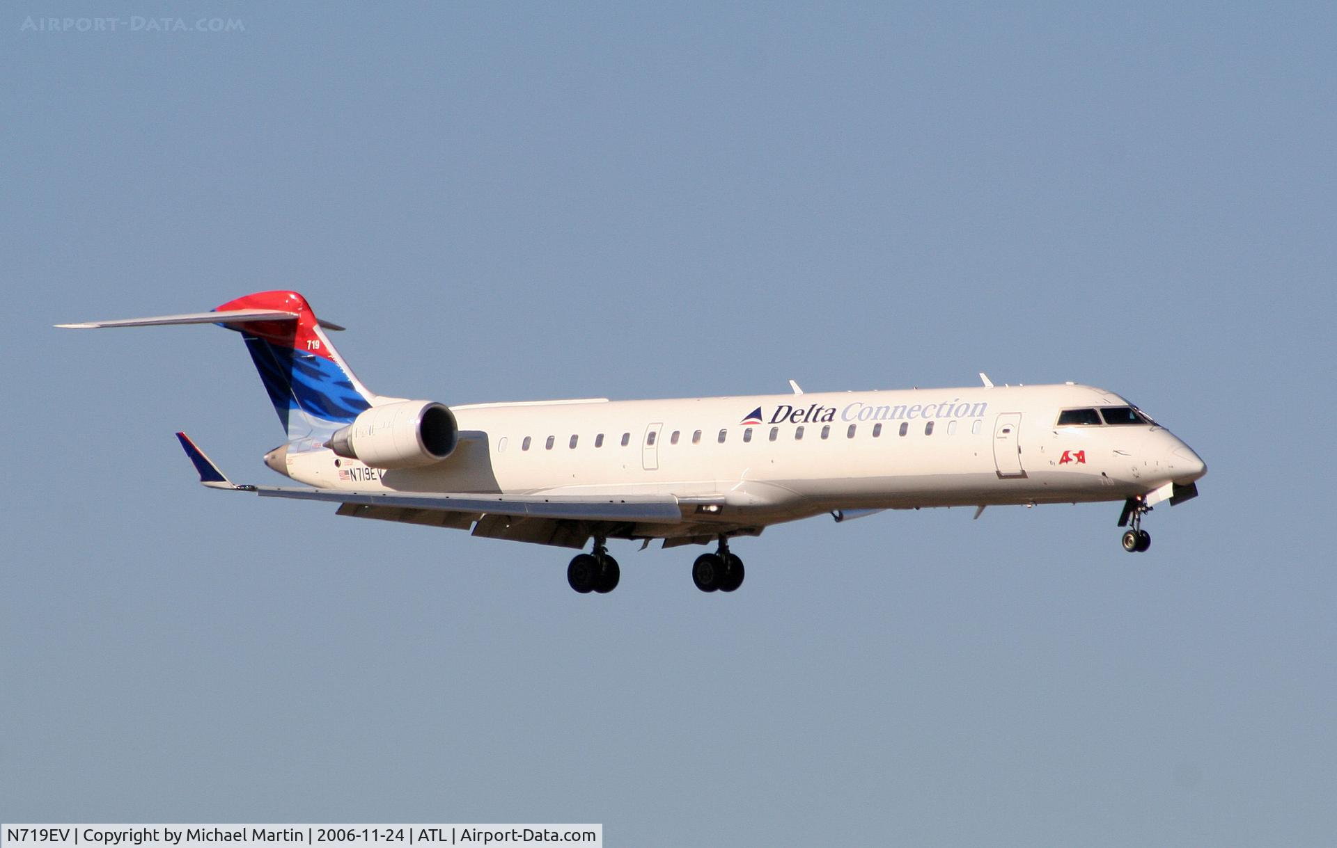 N719EV, 2003 Bombardier CRJ-701 (CL-600-2C10) Regional Jet C/N 10099, On final for Runway 9R