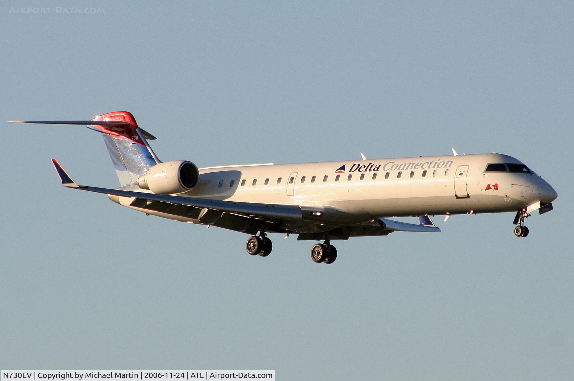 N730EV, 2004 Bombardier CRJ-701 (CL-600-2C10) Regional Jet C/N 10141, On final for Runway 9R