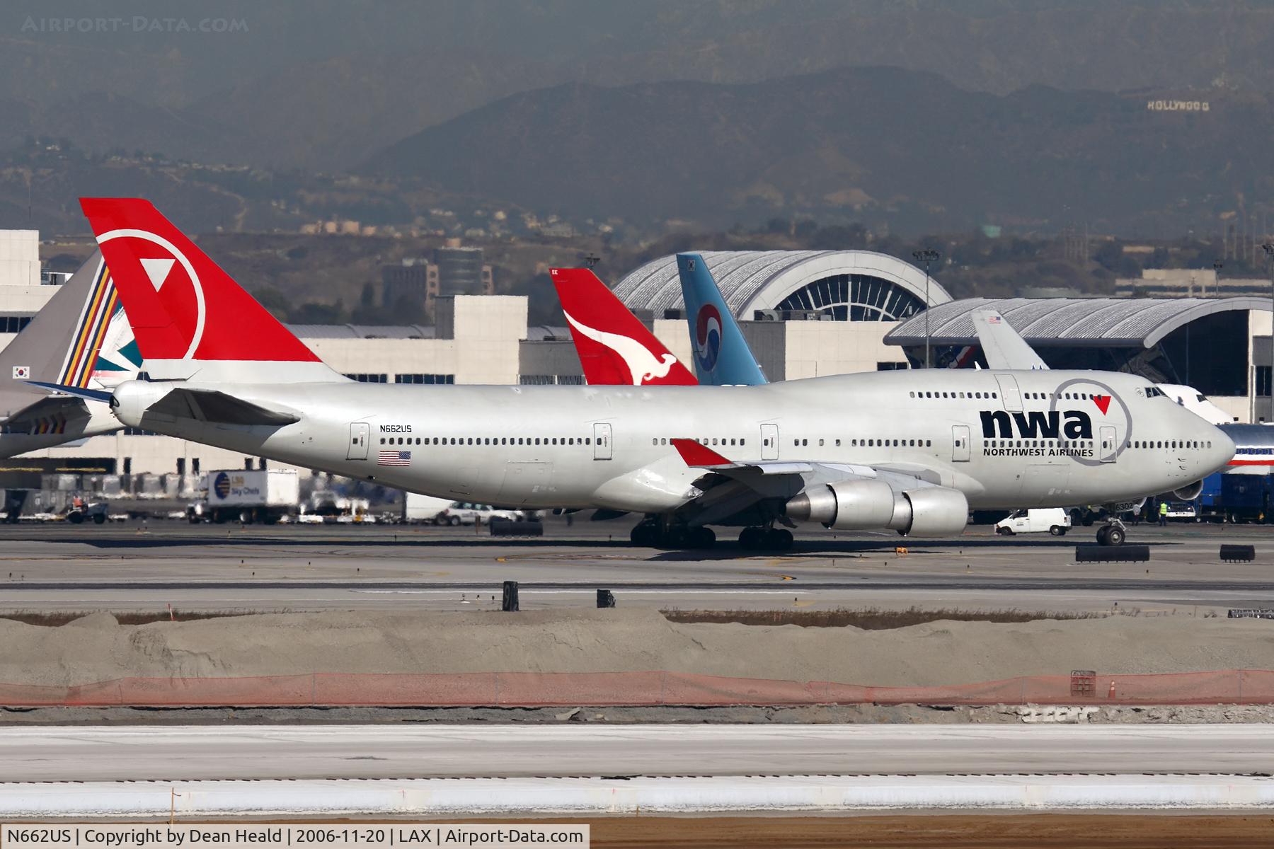 N662US, 1988 Boeing 747-451 C/N 23720, Lots of tails here!  Northwest Airlines N662US (FLT NWA1), destined for Narita Int'l (RJAA), taxiing to RWY 25R.