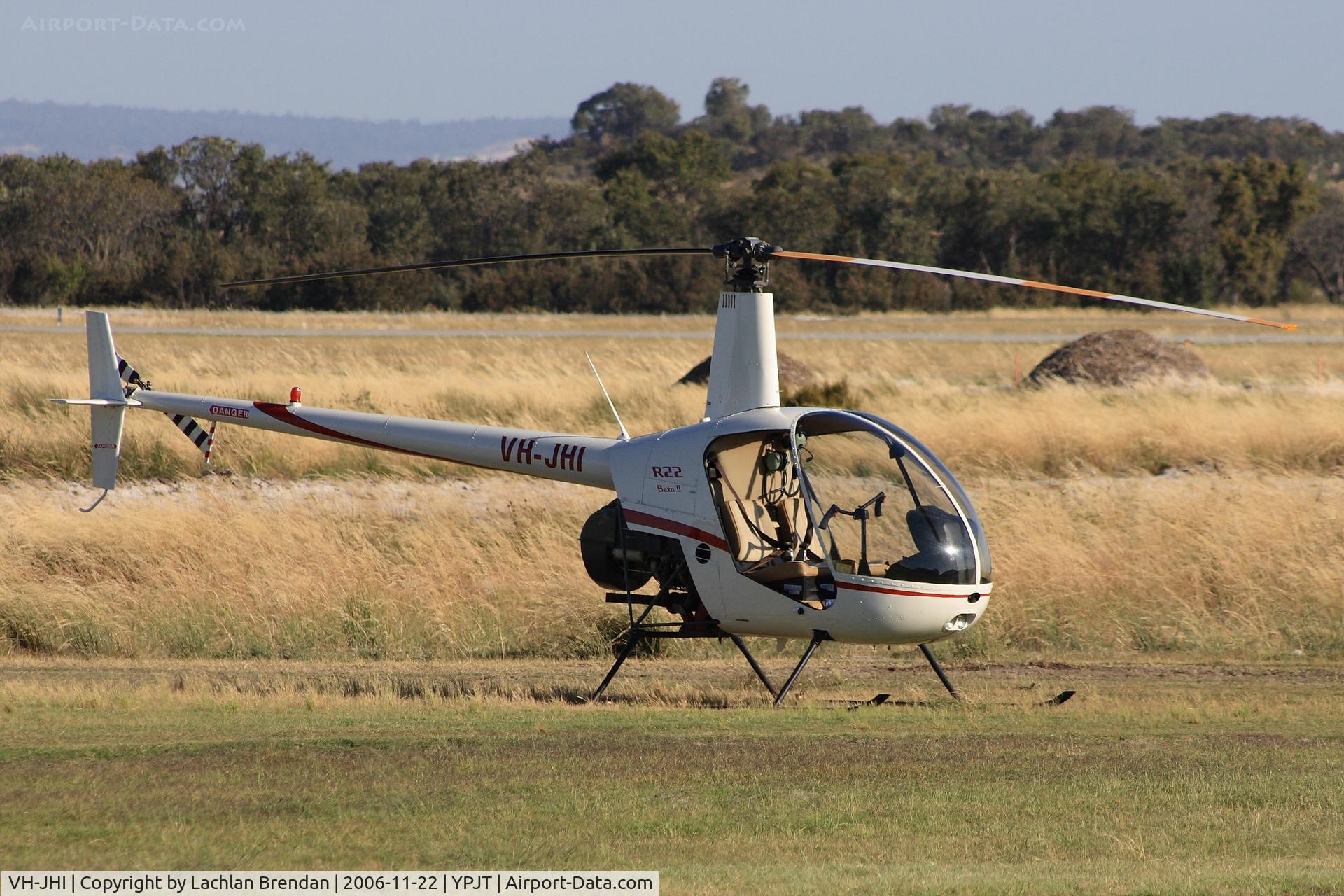 VH-JHI, 2004 Robinson R22 BETA C/N 3711, Robinson R22 Beta out on the grass late in the afternoon.