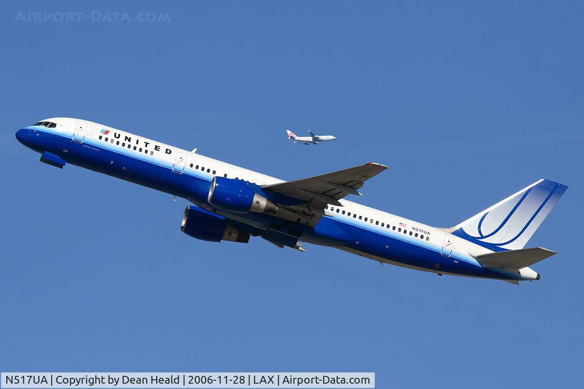 N517UA, 1990 Boeing 757-222 C/N 24861, United Airlines N517UA (FLT UAL890) climbing out from RWY 25R enroute to John F Kennedy Int'l (KJFK).  In the background is China Airlines B-18212 (FLT CAL6) from Chiang Kai Shek (RCTP) on downwind.