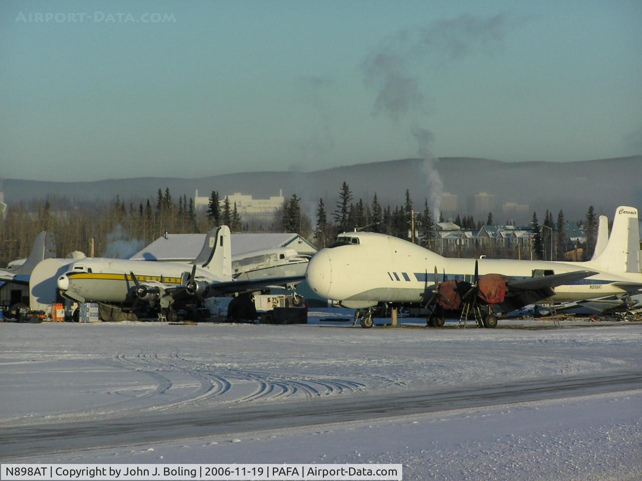 N898AT, 1946 Aviation Traders ATL-98 Carvair C/N 42994, Cargo ramp at Fairbanks; Looks a DC-6/7 highly modified forward of the wing.