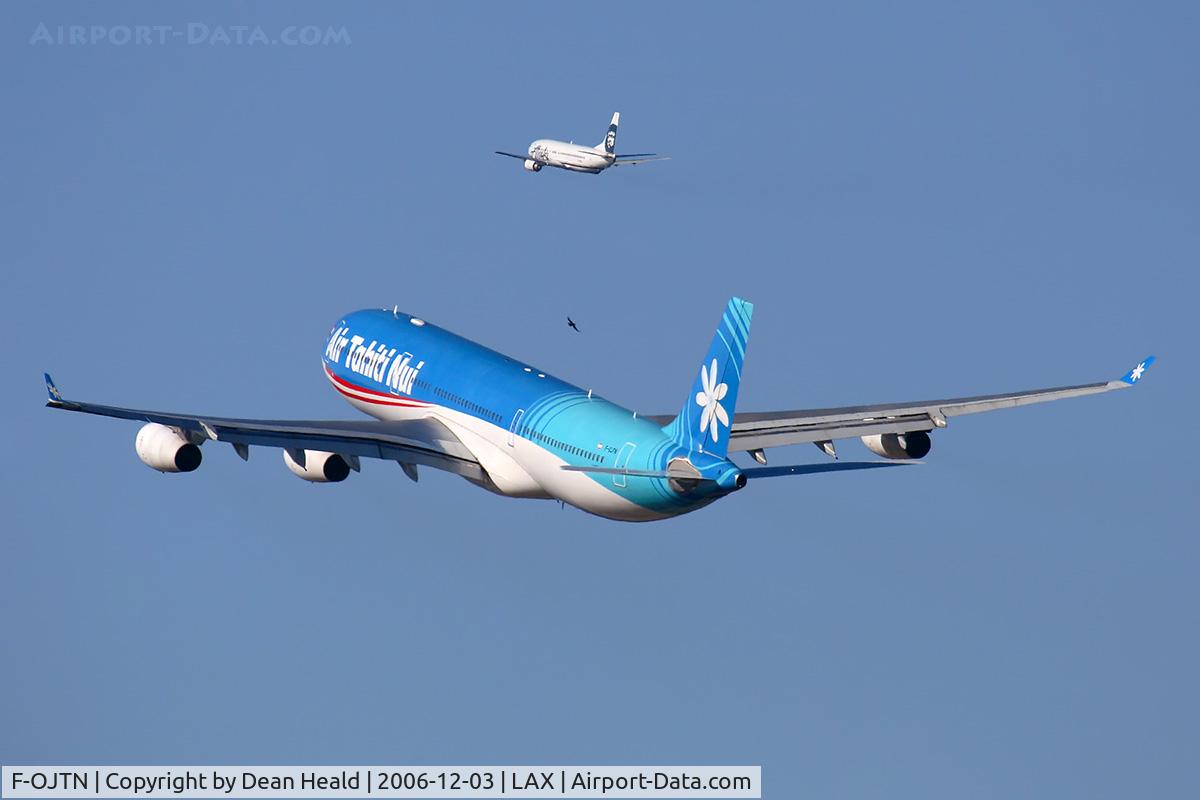 F-OJTN, 2001 Airbus A340-313 C/N 395, Air Tahiti Nui F-OJTN (FLT THT22) climbing out from RWY 25R enroute to Paris Charles De Gaulle (LFPG). In the background, Alaska FLT ASA115 is climbing out from RWY 24L enroute to Seattle Tacoma Int'l (KSEA).