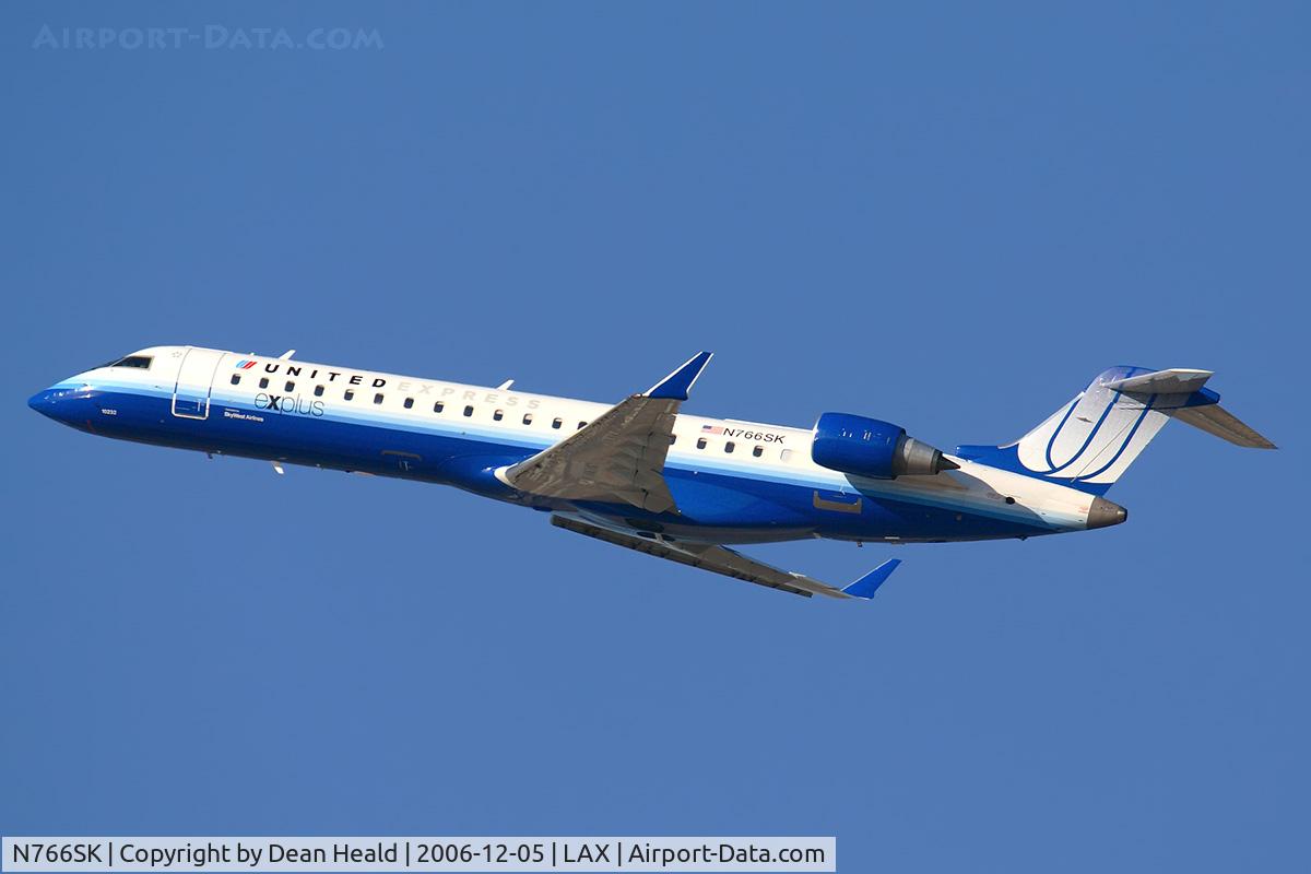 N766SK, 2005 Bombardier CRJ-702 (CL-600-2C10) Regional Jet C/N 10232, United Express (SkyWest Airlines) N766SK (FLT SKW6474) climbing out from RWY 25R enroute to Albuquerque Int'l Sunport (KABQ).