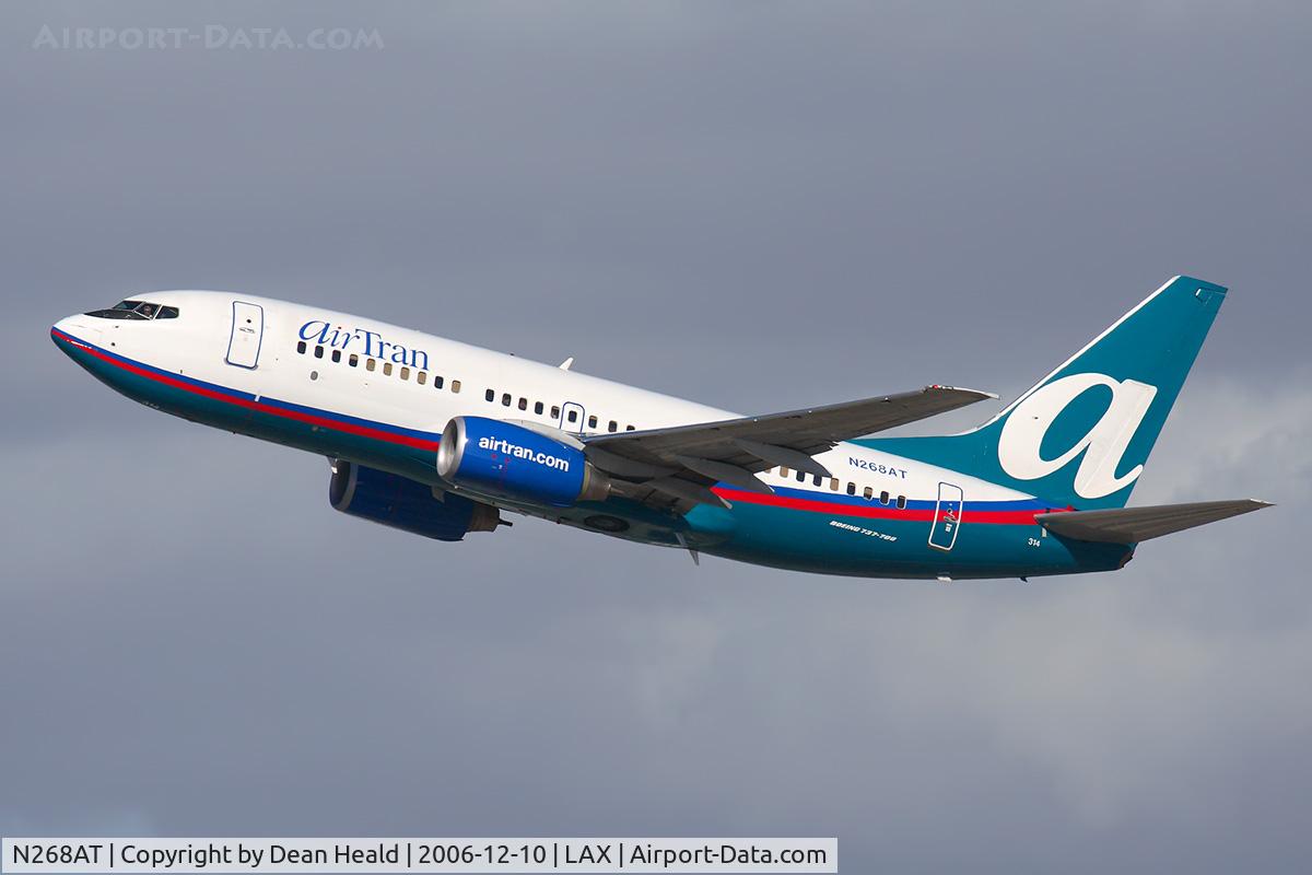 N268AT, 2005 Boeing 737-7BD C/N 33920, AirTran Airways N268AT (FLT TRS53) climbing out from RWY 25R enroute to Hartsfield Jackson Atlanta Int'l (KATL). The pilot is definitely looking towards me.