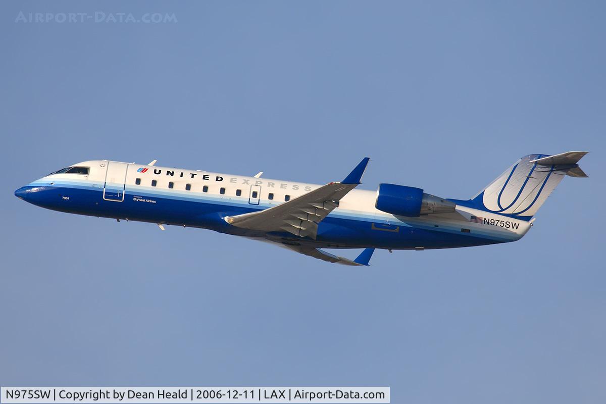 N975SW, 2004 Bombardier CRJ-200ER (CL-600-2B19) C/N 7951, United Express (SkyWest Airlines) N975SW (FLT SKW6498) climbing out from RWY 25R enroute to Phoenix Sky Harbor Int'l (KPHX).
