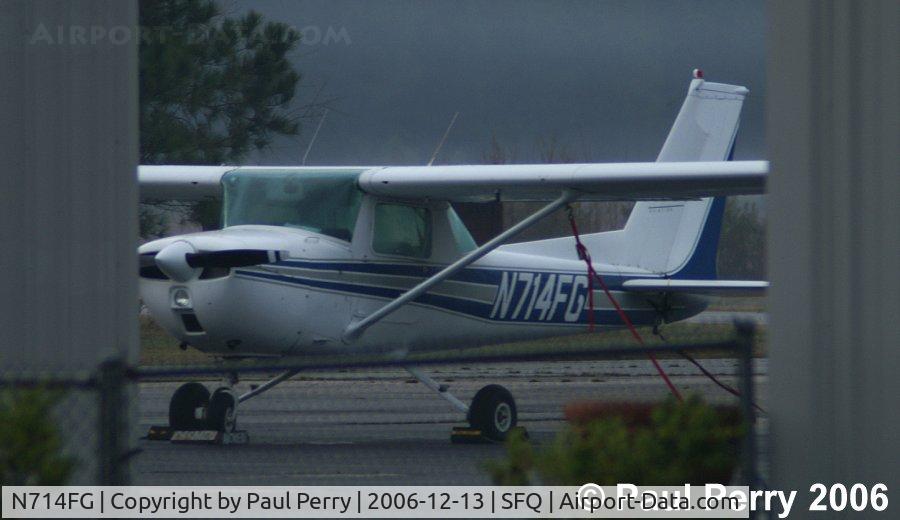 N714FG, 1976 Cessna 150M C/N 15079138, Tucked in near a service area