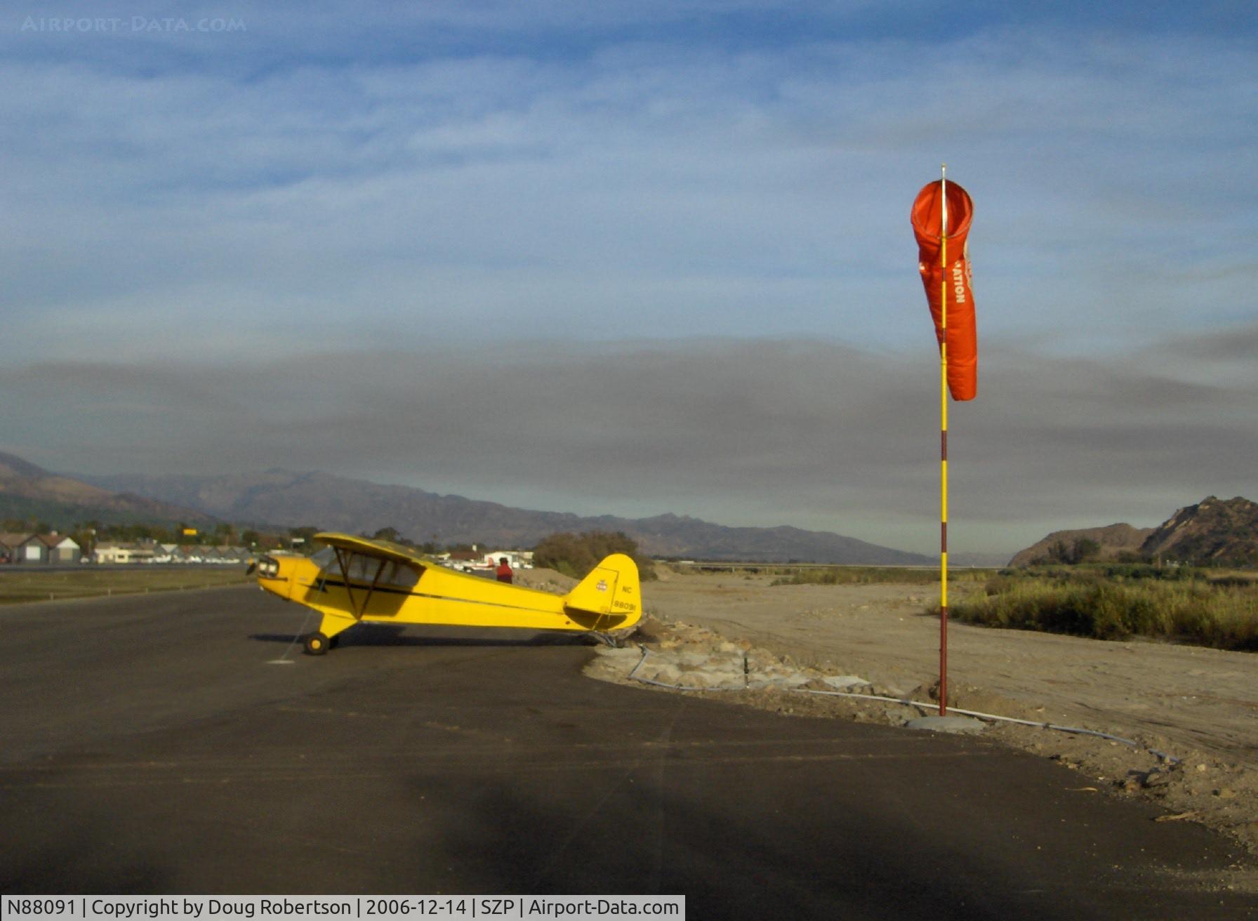 N88091, 1946 Piper J3C-65 Cub Cub C/N 15708, 1946 Piper J3C-65 CUB, Continental C85 85 Hp upgrade, mountain fire smoke in distance