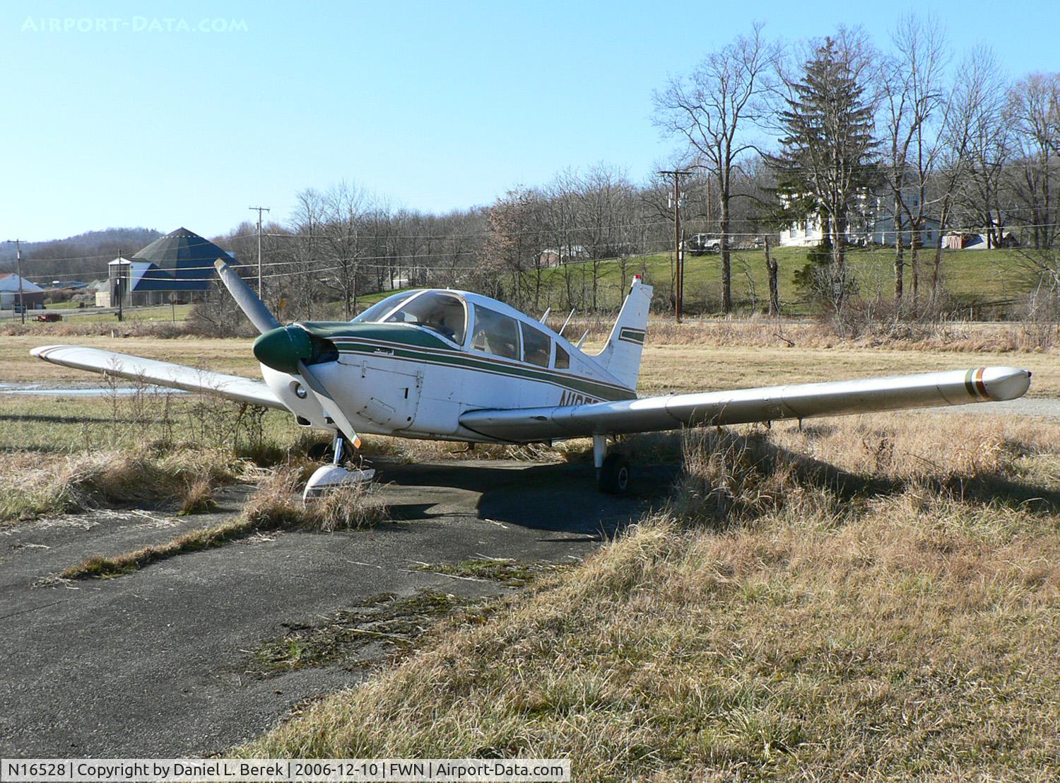 N16528, 1973 Piper PA-28-180 C/N 28-7305275, Tires flat, this 1973 Piper Cherokee Archer appears to have occupied its parking space for a long time.